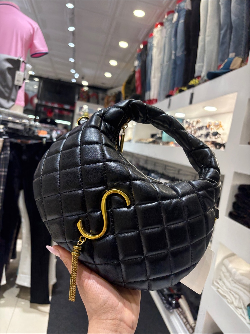 Quilted Black Crescent Shoulder Bag with Gold Accent